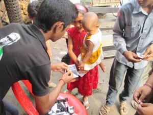 Early in the morning people in Phulbari, including children, getting ready by wearing black badges to join a rally to the martyrs monument to express their love, respect and gratitude to the three sacrificed lives, namely Al-Amin, Tariqul and Salekin, three children who were shot dead by the Border Guards of Bangladesh Government on 26 August in 2006